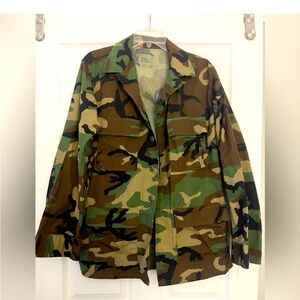 This item is a U.S. Woodland camouflage Battle Dress Uniform (BDU) jacket.